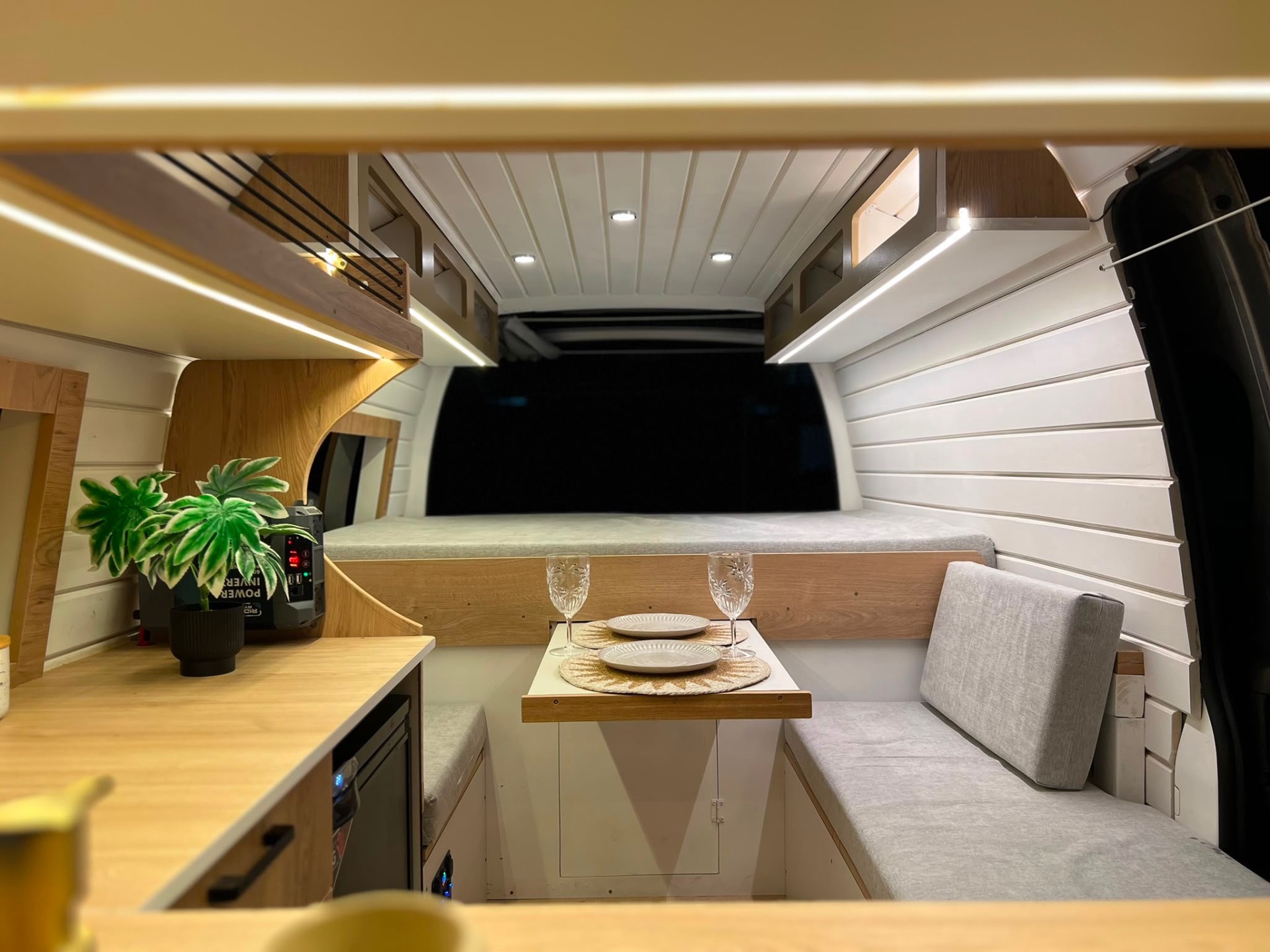Night shot — LED strip lighting warm over the bench